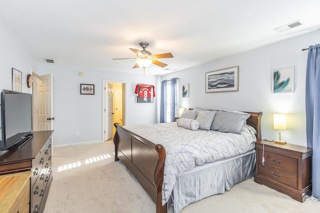 bedroom featuring light carpet and ceiling fan