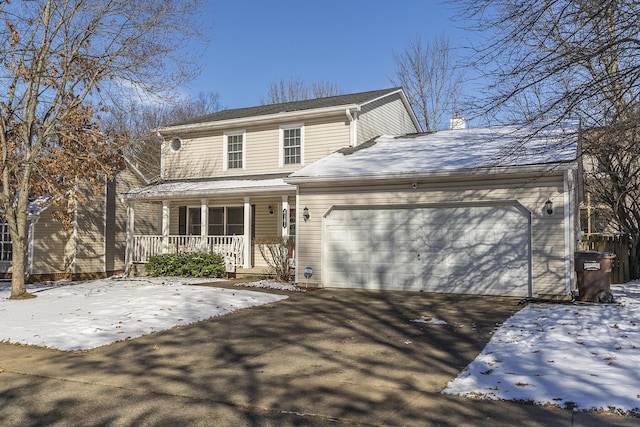 front of property with a porch and a garage