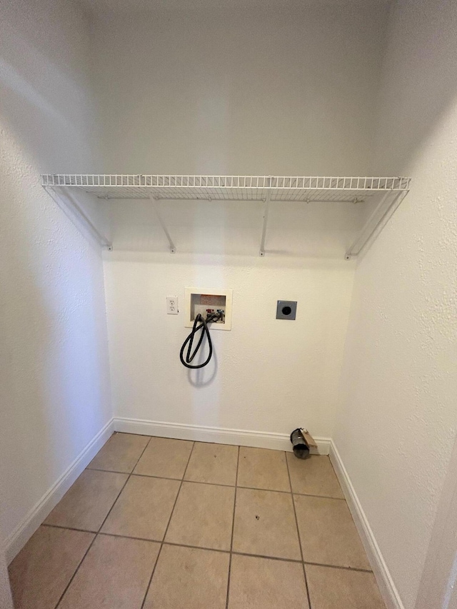1465 Blaze Valley Rd, Somerset, KY 42501 - washroom featuring electric dryer hookup, hookup for a washing machine, baseboards, and light tile patterned floors