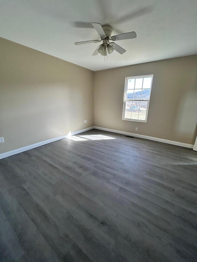 1465 Blaze Valley Rd, Somerset, KY 42501 - empty room featuring a ceiling fan, baseboards, and dark wood-style flooring