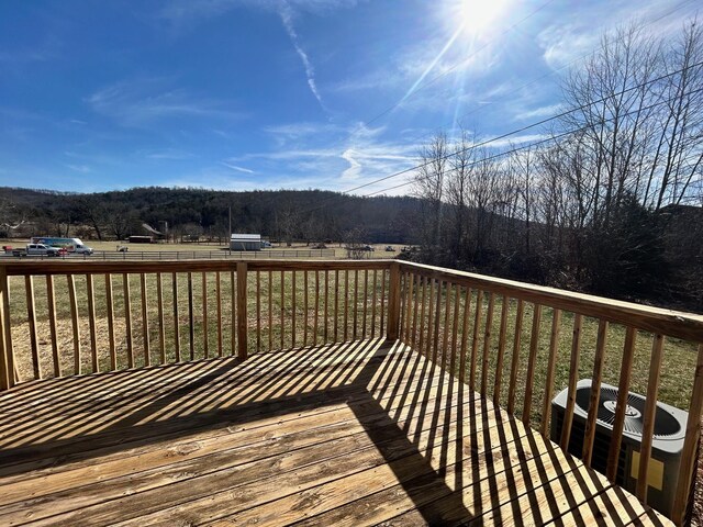 wooden deck featuring a mountain view