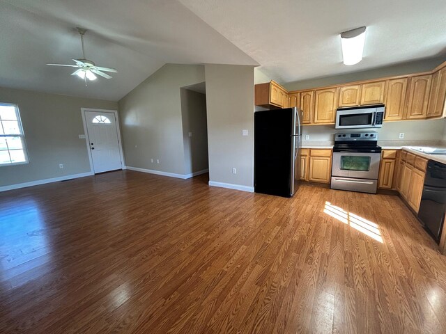 kitchen featuring appliances with stainless steel finishes, sink, and light hardwood / wood-style flooring