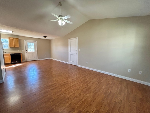1465 Blaze Valley Rd, Somerset, KY 42501 - unfurnished living room with a ceiling fan, dark wood-style floors, lofted ceiling, and baseboards