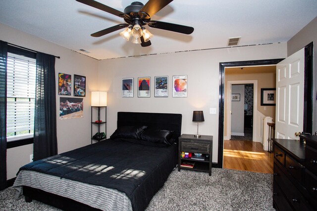 bedroom featuring ceiling fan and carpet flooring