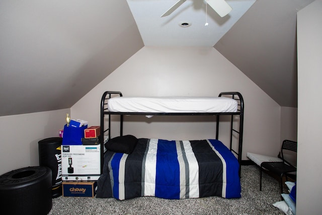 carpeted bedroom with a ceiling fan and vaulted ceiling