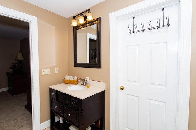 bathroom featuring vanity and baseboards