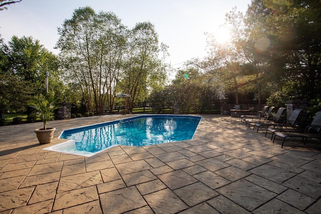 outdoor pool with a patio