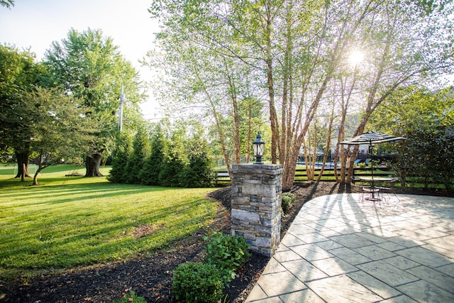 view of home's community featuring a patio area, a yard, and a gazebo