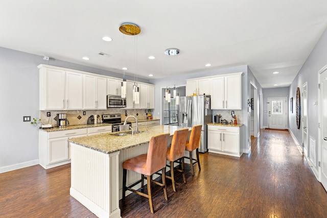 kitchen with stainless steel appliances and white cabinets