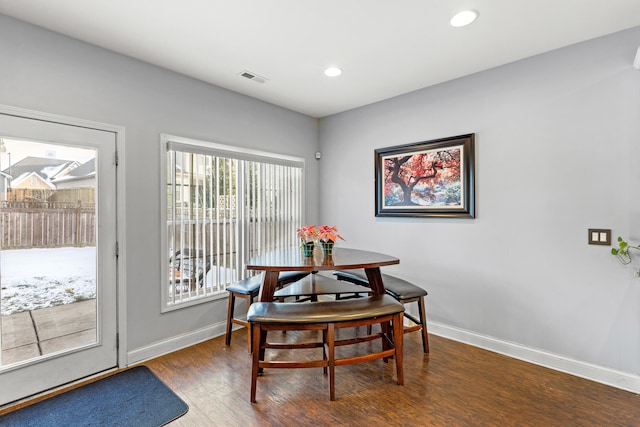 dining area featuring dark hardwood / wood-style flooring