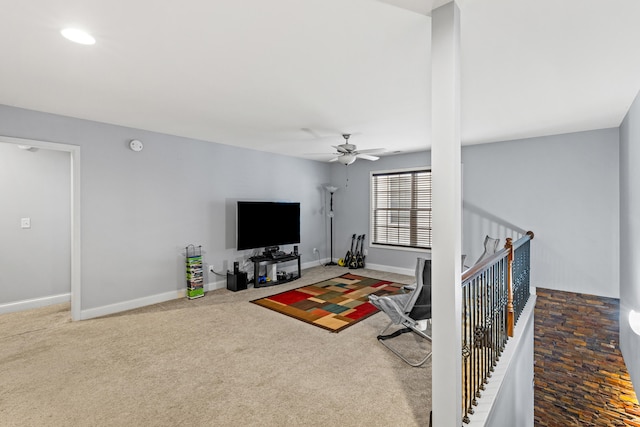 living room featuring carpet and ceiling fan