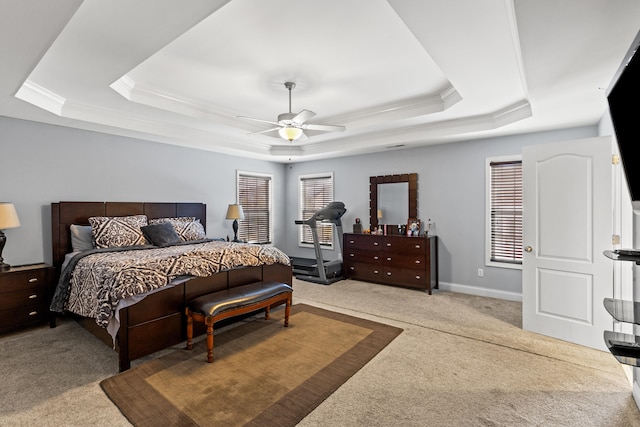 bedroom featuring crown molding, ceiling fan, carpet flooring, and a raised ceiling