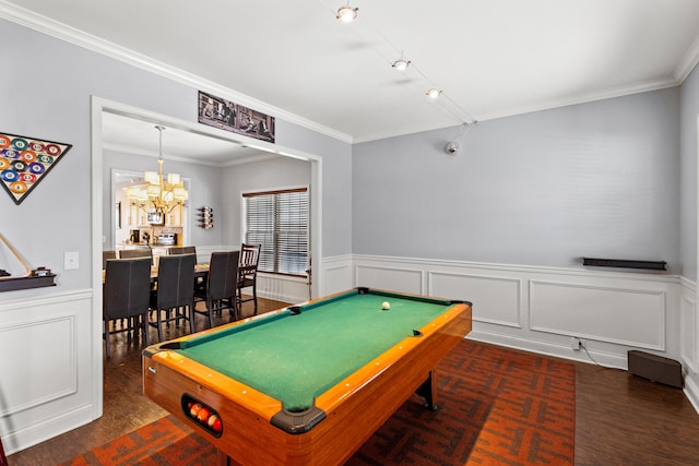 recreation room with dark wood-type flooring, billiards, ornamental molding, and a notable chandelier