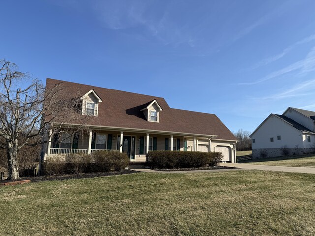 cape cod house featuring covered porch, a garage, and a front lawn