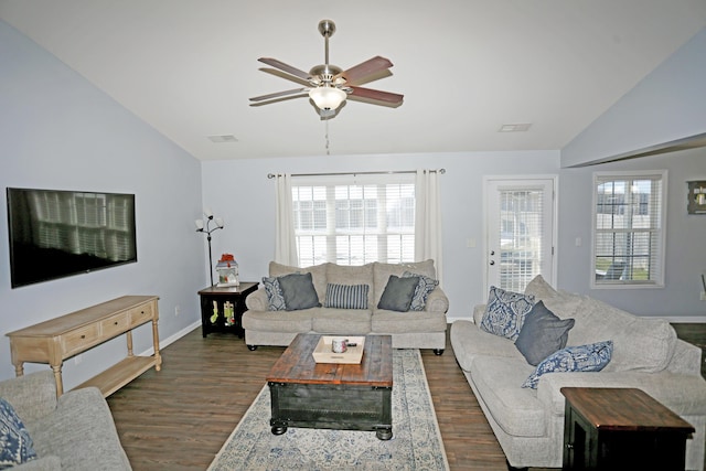 living room featuring dark hardwood / wood-style flooring, vaulted ceiling, and ceiling fan