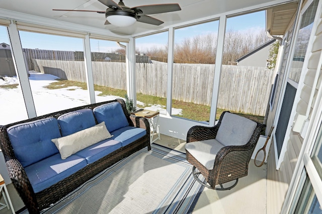 sunroom featuring ceiling fan