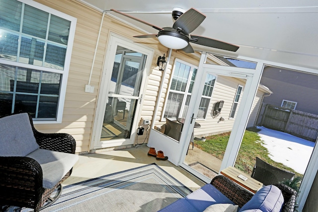 sunroom / solarium with ceiling fan