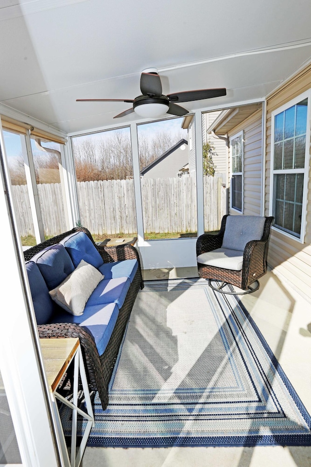 sunroom / solarium featuring ceiling fan and a healthy amount of sunlight