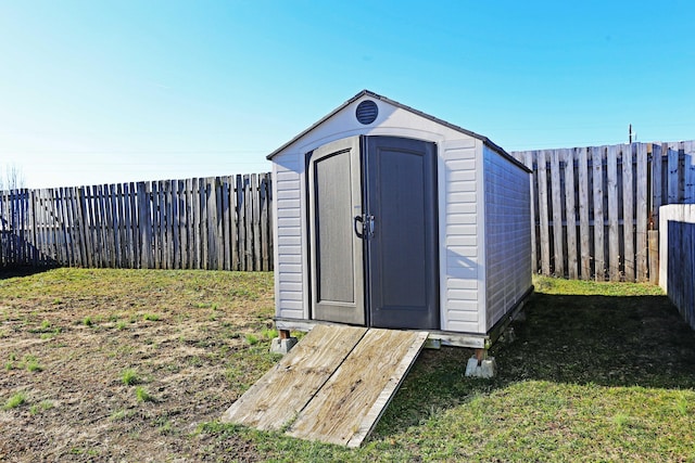 view of outbuilding with a lawn