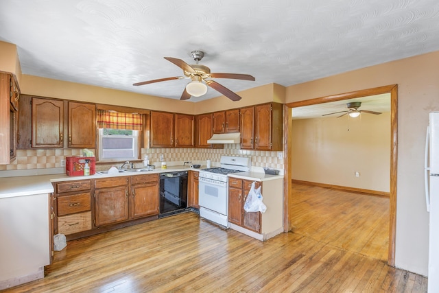 kitchen with ceiling fan, white appliances, light wood-type flooring, sink, and backsplash