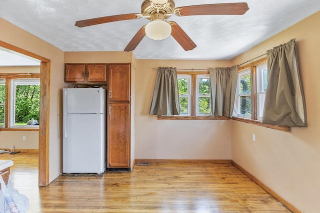 kitchen featuring white refrigerator and light wood-type flooring