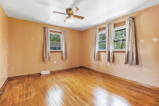 spare room featuring ceiling fan and light wood-type flooring