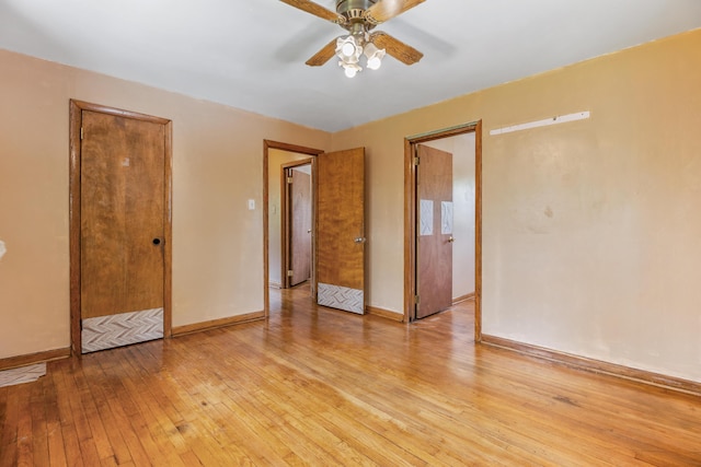 spare room featuring light hardwood / wood-style flooring and ceiling fan