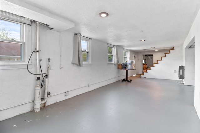 basement with a textured ceiling