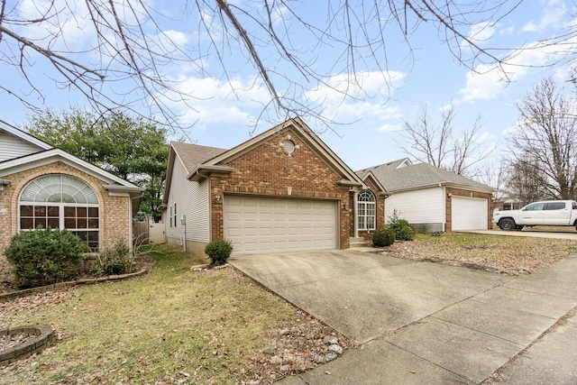 view of front of property with a garage and a front lawn