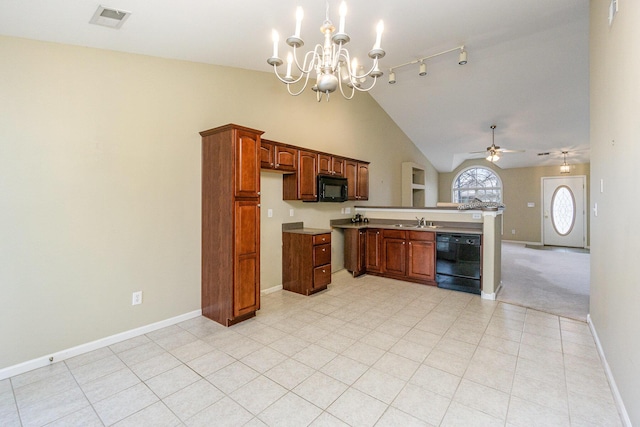 kitchen featuring sink, rail lighting, high vaulted ceiling, black appliances, and ceiling fan with notable chandelier