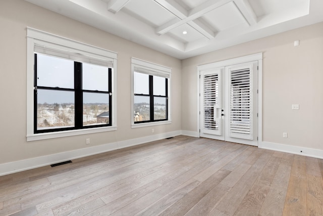 unfurnished bedroom with beamed ceiling, coffered ceiling, light wood-type flooring, french doors, and access to outside