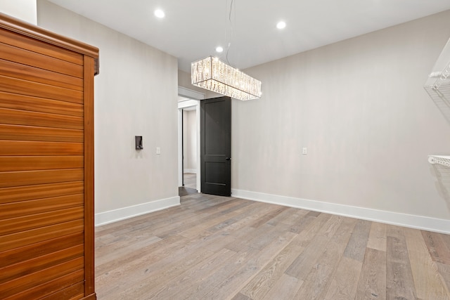 unfurnished dining area with light hardwood / wood-style floors