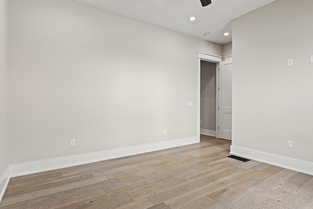 spare room with light hardwood / wood-style floors and ceiling fan