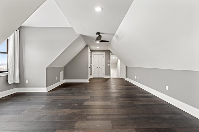 bonus room featuring ceiling fan, dark hardwood / wood-style flooring, and lofted ceiling