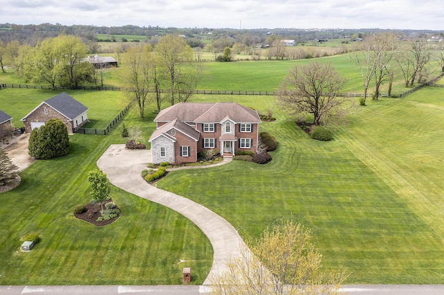 birds eye view of property featuring a rural view