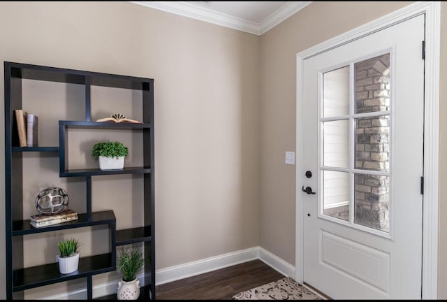 foyer entrance with crown molding and dark hardwood / wood-style flooring