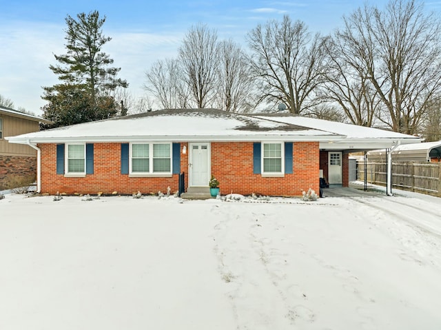 single story home featuring a carport