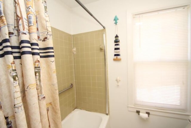 bathroom featuring shower / bathtub combination with curtain