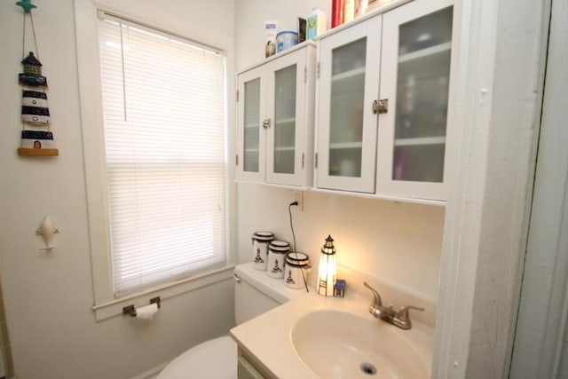 bathroom with vanity and toilet