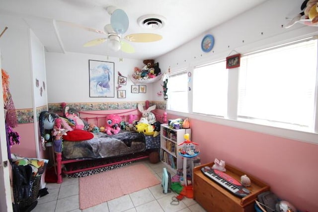 bedroom featuring a ceiling fan, visible vents, and tile patterned floors