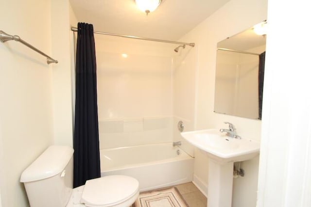 full bathroom featuring toilet, shower / bathtub combination with curtain, and tile patterned flooring