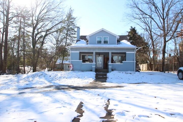 bungalow with a chimney and a porch