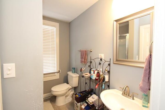 bathroom featuring a sink and toilet