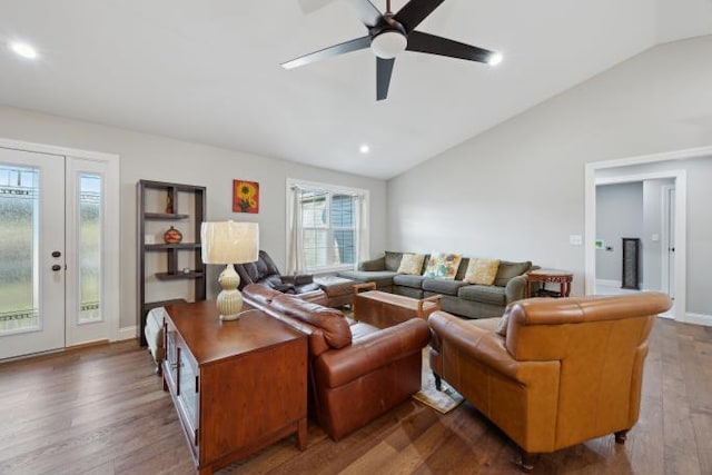 living area featuring recessed lighting, a ceiling fan, vaulted ceiling, wood finished floors, and baseboards