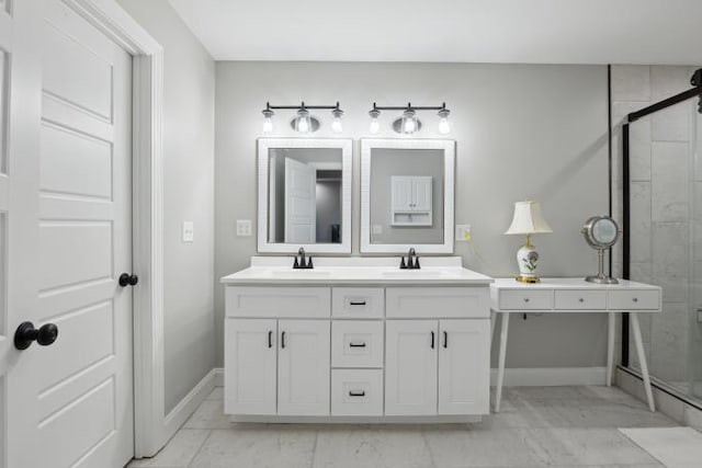 full bathroom with marble finish floor, a sink, and a stall shower