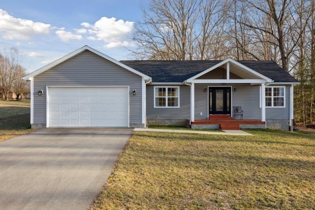 single story home featuring a front yard, driveway, and an attached garage