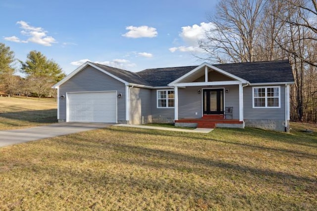 ranch-style home with an attached garage, driveway, and a front yard