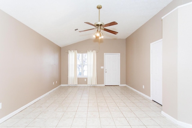 unfurnished room featuring lofted ceiling, light tile patterned floors, and ceiling fan