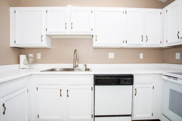 kitchen with white cabinetry, white appliances, and sink