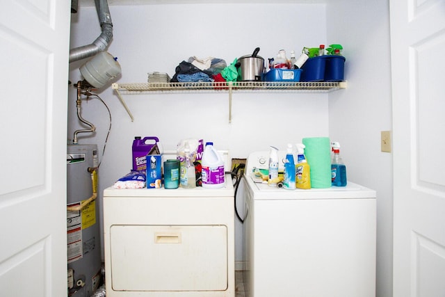 laundry room featuring gas water heater and independent washer and dryer